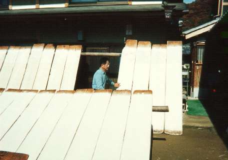 Mr Fukunishi checks on the paper drying in the sun